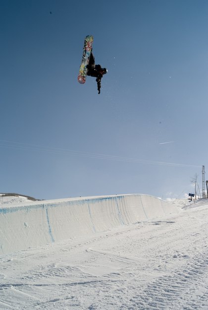 Keir Dillon airborne above the halfpipe in Park City